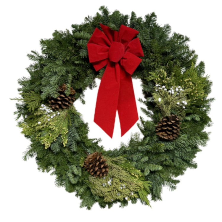 Large decorated mixed Noble Fir wreath with pinecones and red velvet bow