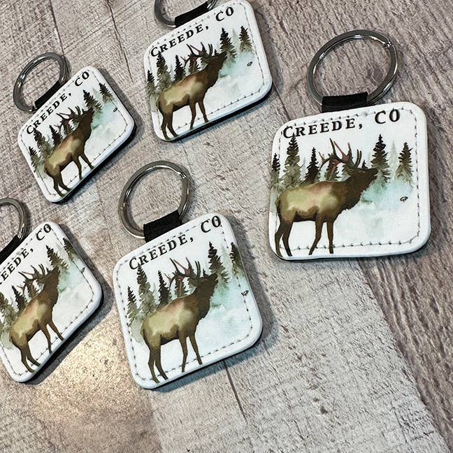 Evergreen trees with  Elk Key Ring 