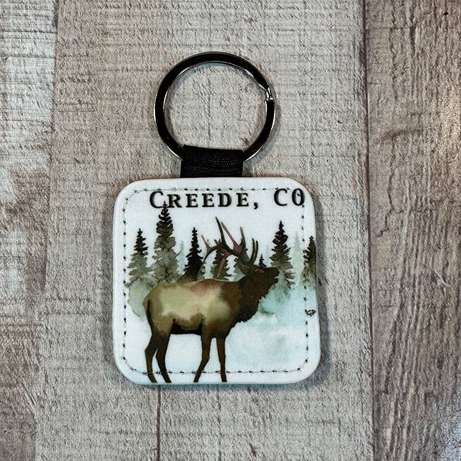 Evergreen trees with  Elk Key Ring 