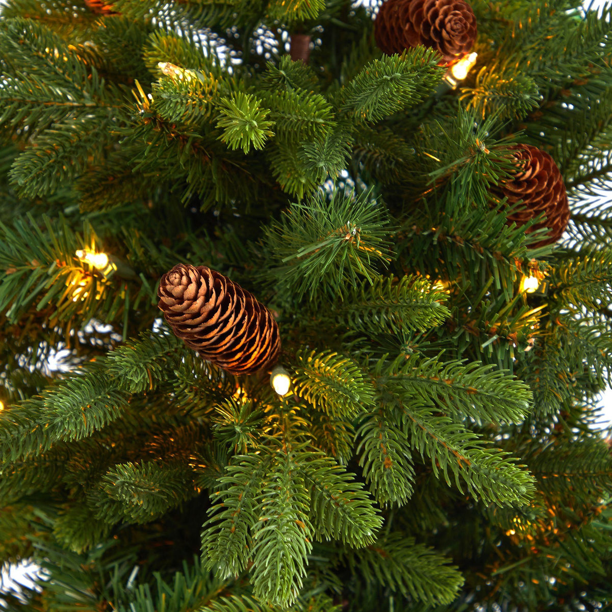 4.5’ Yukon Mountain Fir Artificial Christmas Tree with 100 Clear Lights, Pine Cones and 386 Bendable Branches in Charcoal Planter